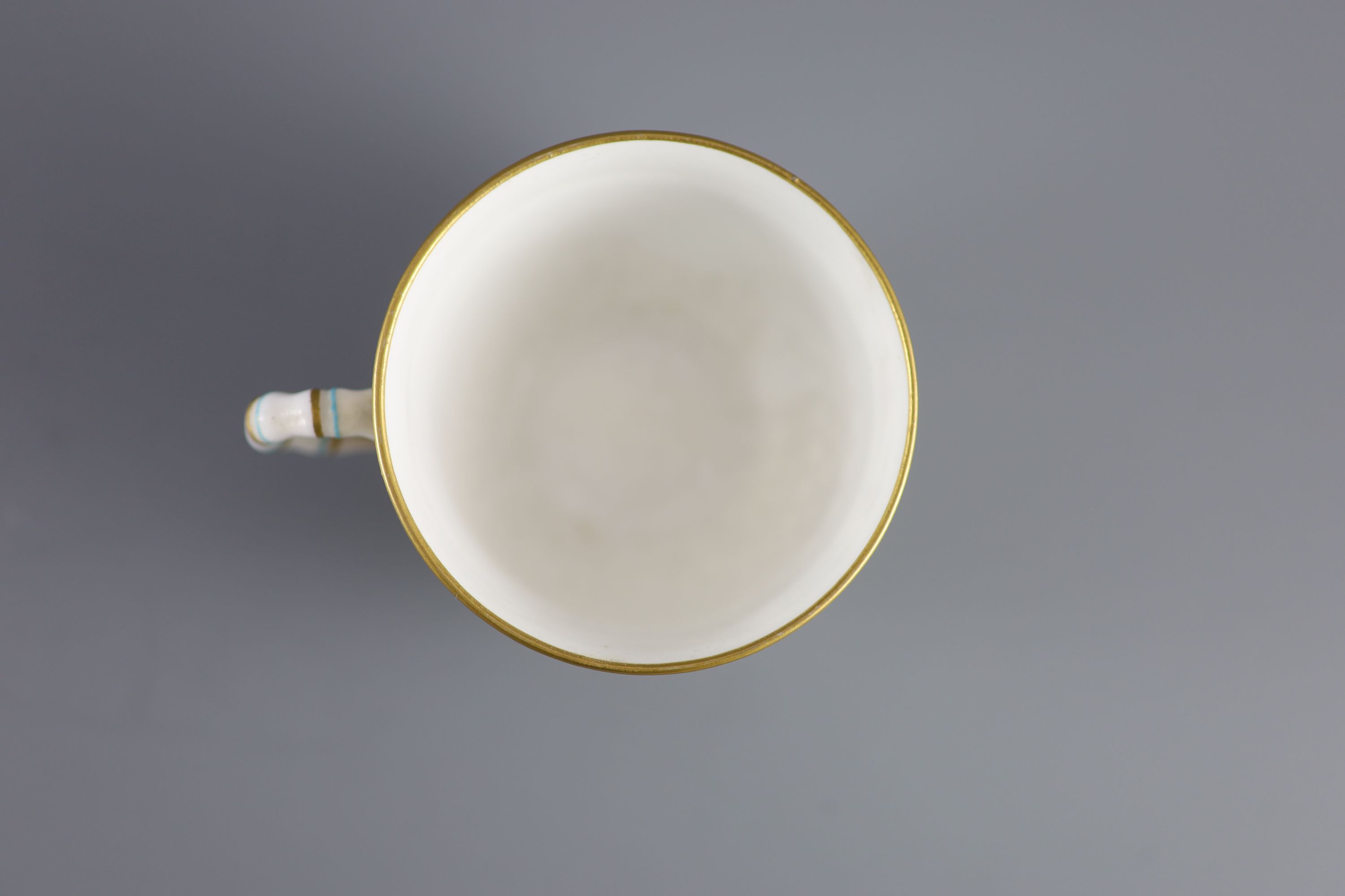 A Royal Worcester 'jewelled' and reticulated cup and saucer